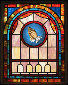 Stained glass with hands praying